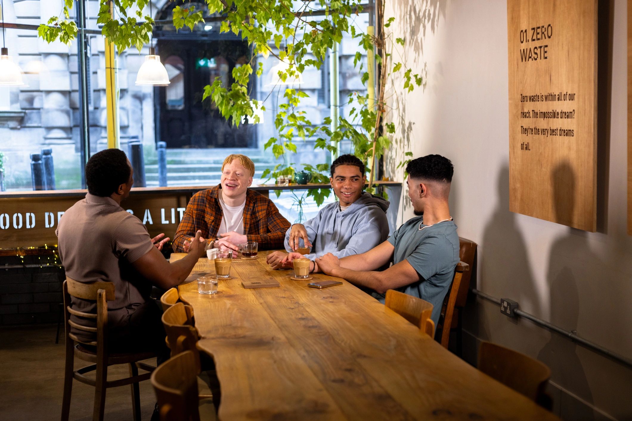 Friends enjoying a warm cafe gathering that suits a board game date night