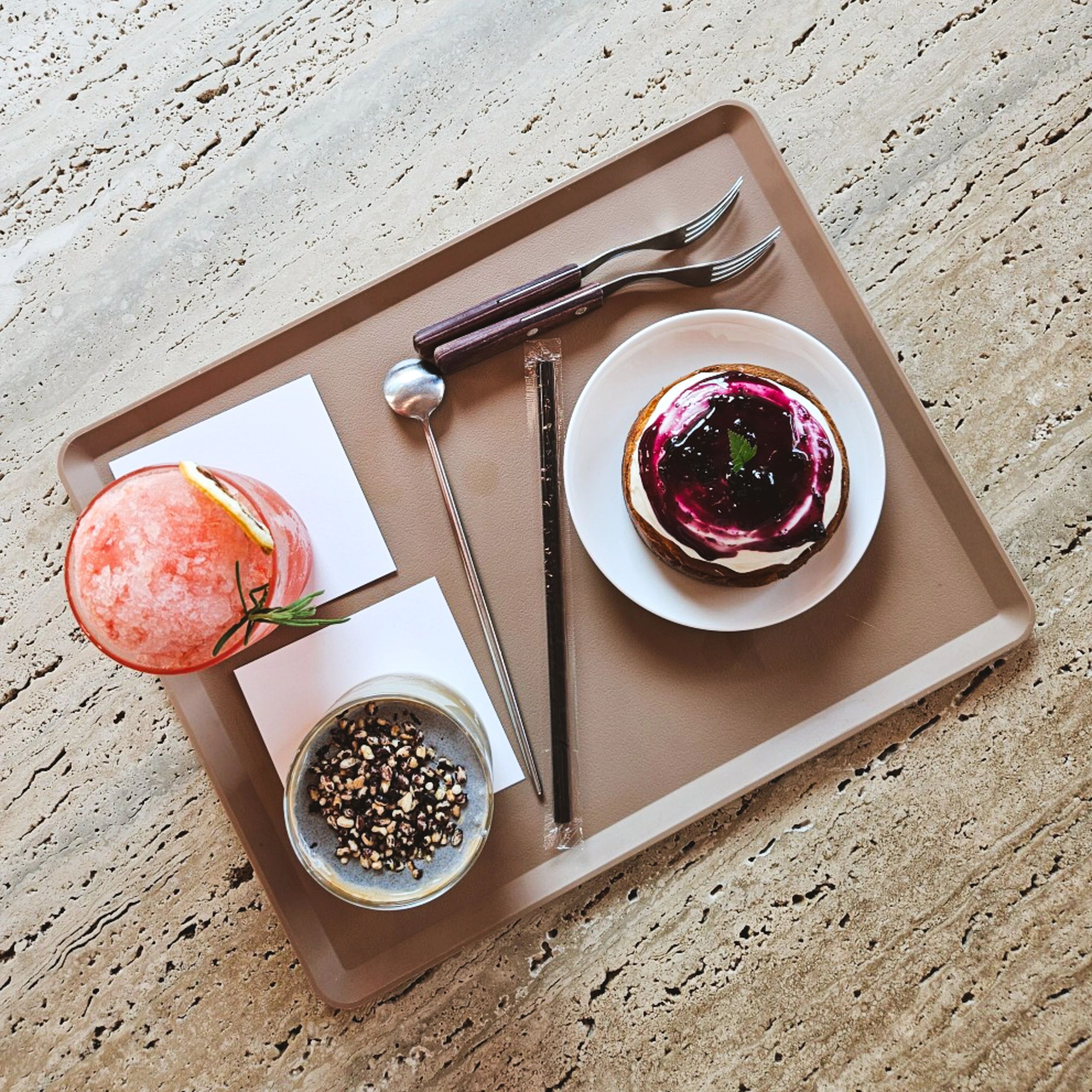 Dessert and drink on a modern cafe tray