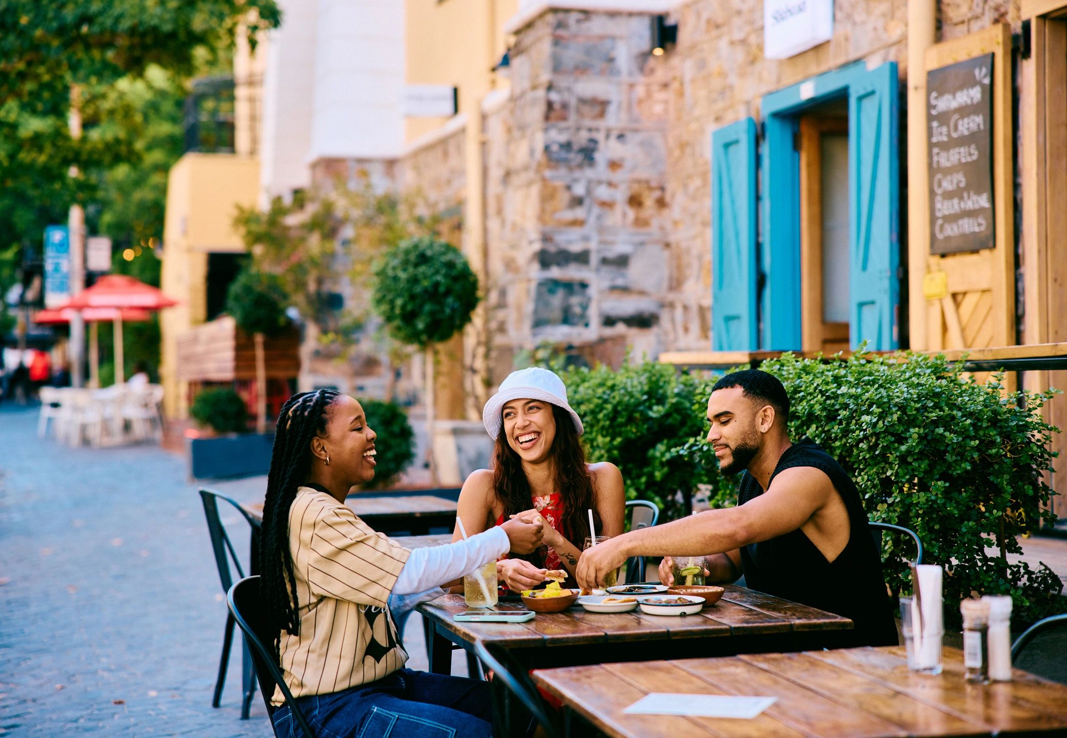 Group of friends sharing drinks and conversation during a lively social night