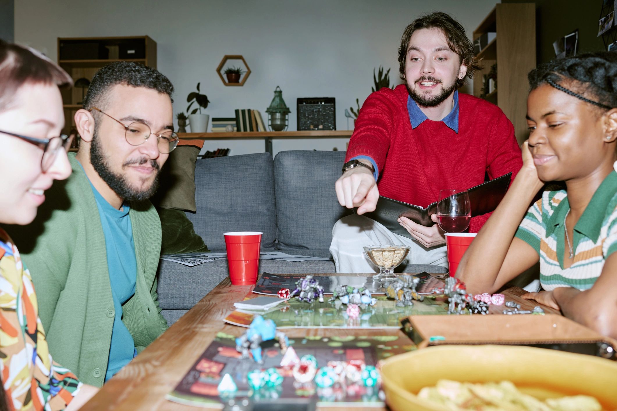 Friends playing a tabletop game together during a social gathering